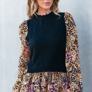 Pull à basque à manches florales contrastées